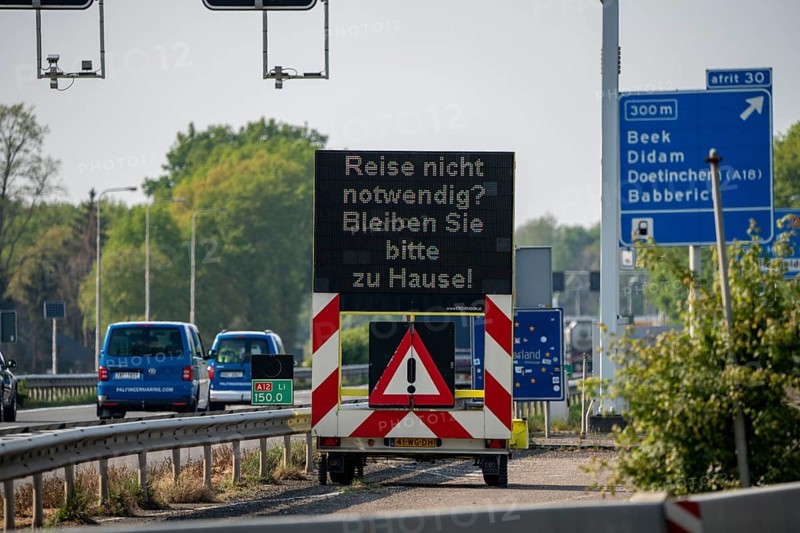 German-Dutch border at Emmerich-Elten, A3 motorway, signal board asks travellers to only make necessary journeys to the Netherlands, effects of the corona crisis in Germany