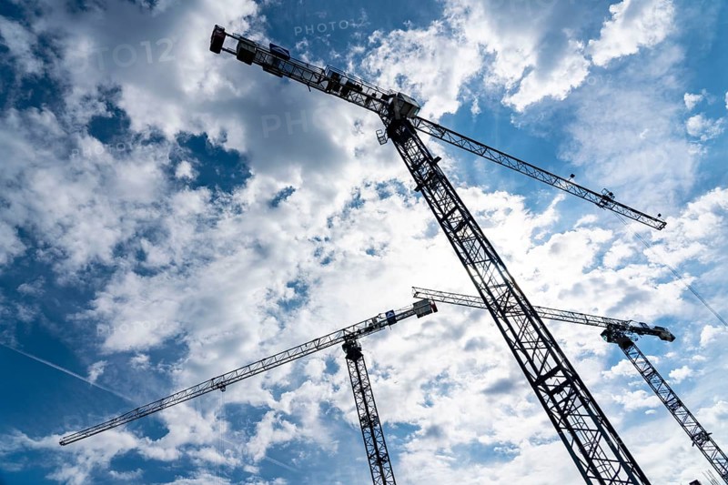 Construction cranes on two large construction sites, construction of office buildings in Dortmund-Schüren-Neu, North Rhine-Westphalia, Germany, Europe