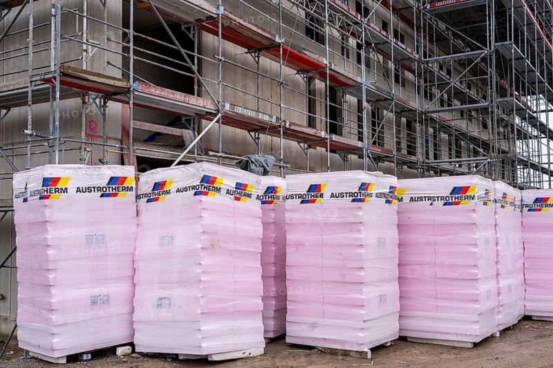 New construction, shell construction, thermal insulation, material waiting to be installed on the façade, energy insulation