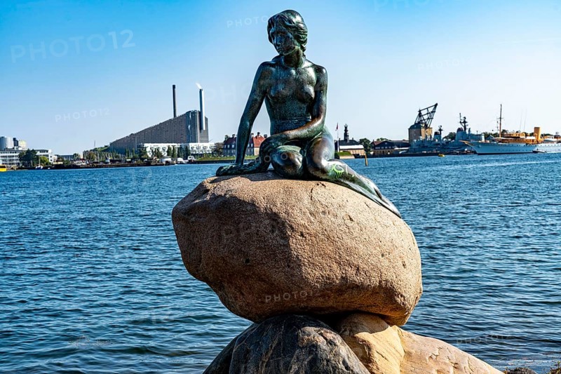 The Little Mermaid statue, Den lille Havfrue in Danish, on the Langelinie waterfront promenade in Copenhagen, is considered the smallest landmark in the world, bronze figure on a boulder, Copenhagen Denmark