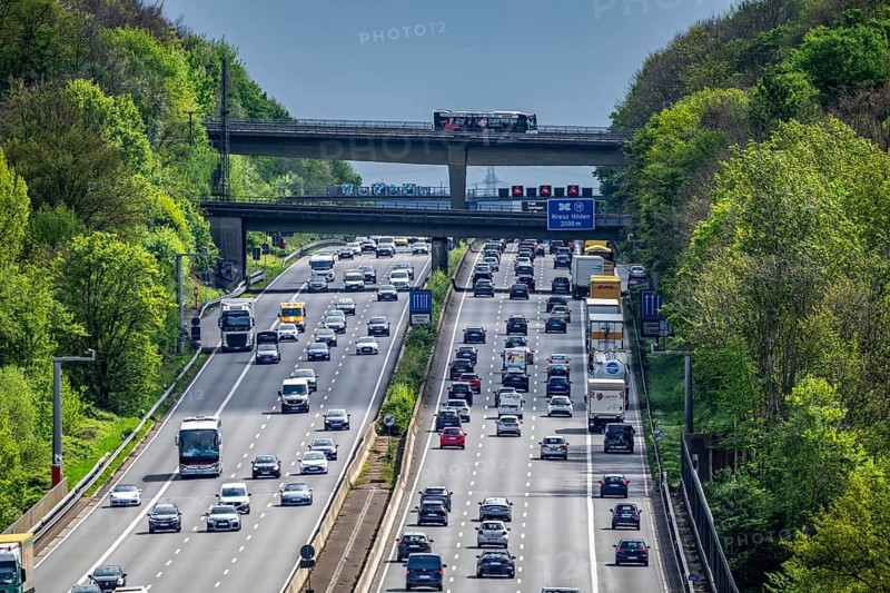 The A3 motorway, heavy traffic on 8 lanes, including the temporarily open hard shoulder, in front of the Hilden motorway junction, looking south, near Erkrath, North Rhine-Westphalia, Germany, Europe