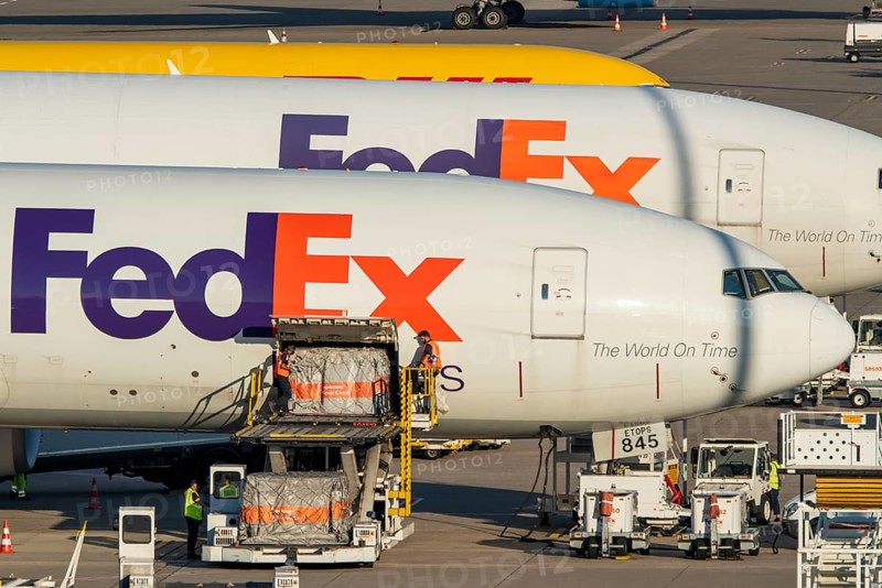 Cologne-Bonn Airport, CGN, FedEx cargo planes standing in front of the air cargo centre, being loaded and unloaded, Eurowings Airbus, North Rhine-Westphalia, Germany, Europe