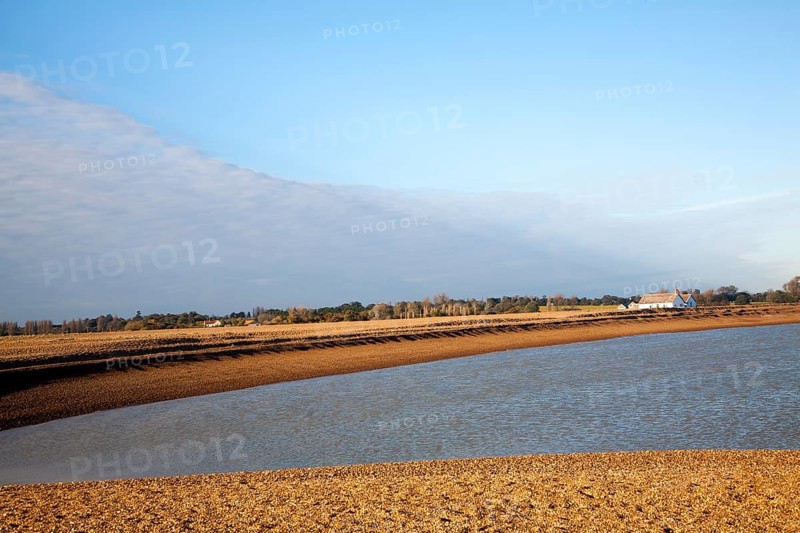 Seaside bungalow on shingle beach near North Weir Point, Shingle Street, Suffolk, England, UK