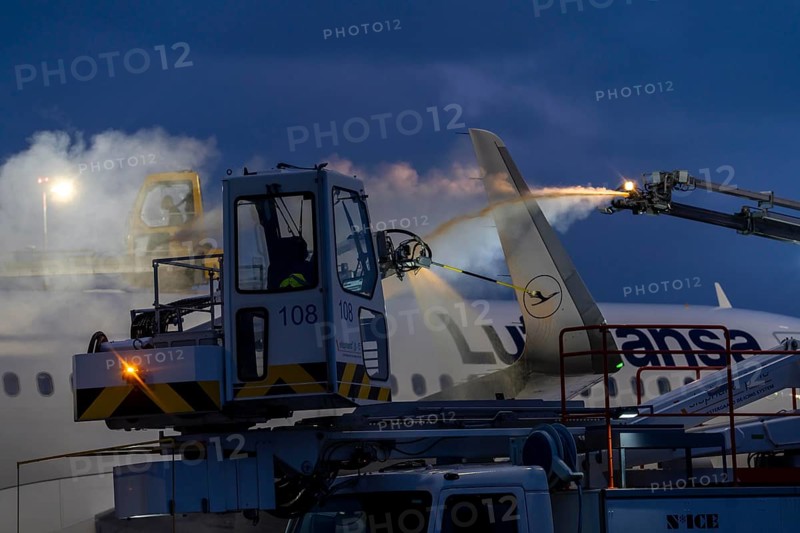 Winter at Frankfurt Main Airport, FRA, Lufthansa aircraft being de-iced by de-icing vehicles, Hesse, Germany, Europe