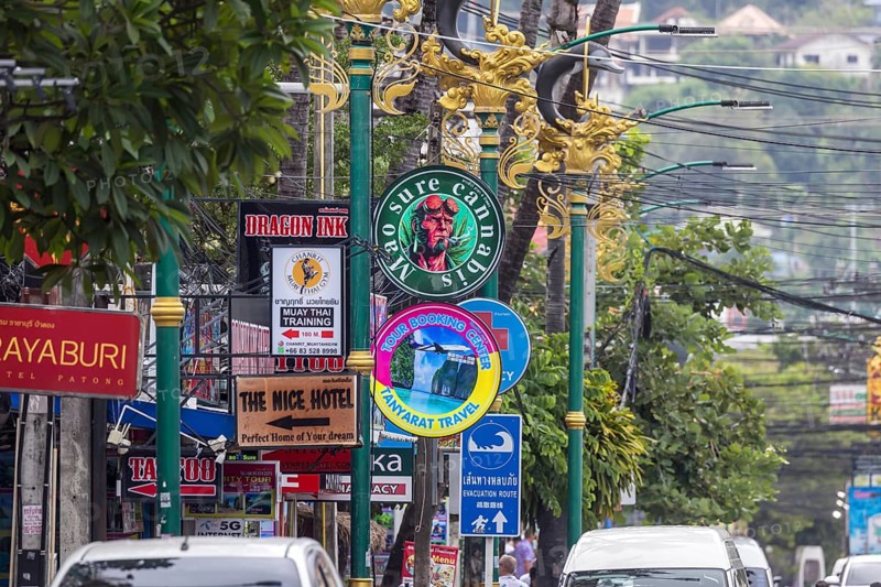 Tsunami Hazard Zone. Warning sign, signposting of escape routes in the event of another seaquake. Beach area and coastal road in the town of Patong, Kathu, Phuket Island, Thailand, Asia