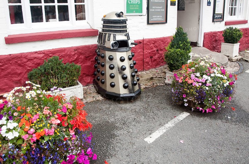 Dr Who Dalek model used as a waste bin, Aldbourne, Wiltshire, England, United Kingdom, Europe