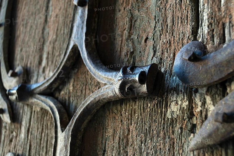Orcival. Intricate Roman wrought iron hinge displayed at the Basilica Notre-Dame d'Orcival, Puy de dome, Auvergne-Rhone-Alpes, France, Europe