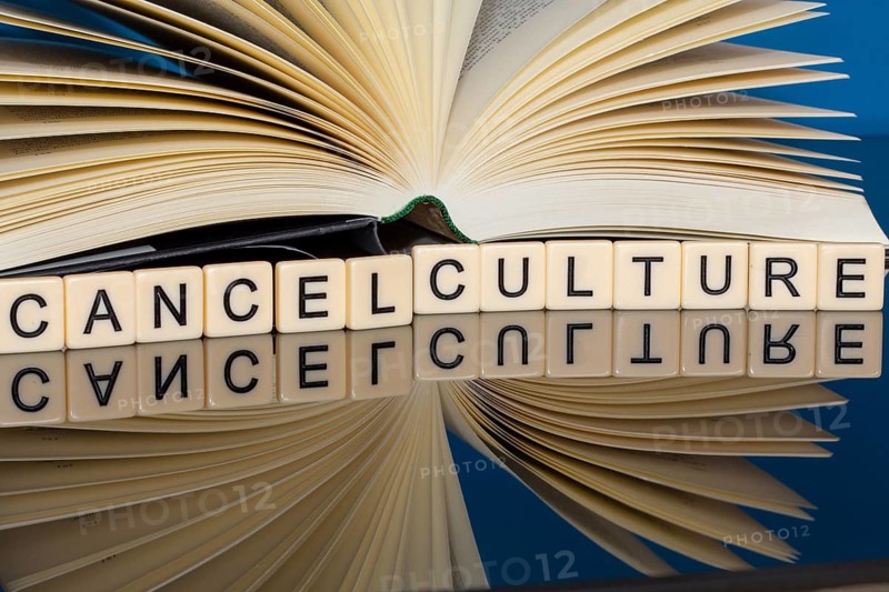 Symbolic image Cancel Culture: Letter cubes show the words Cancel Culture in front of a book