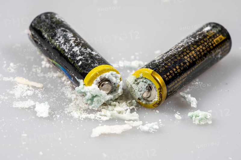 Leaked batteries, AA batteries, oxidised, leaked potassium carbonate and ammonium chloride