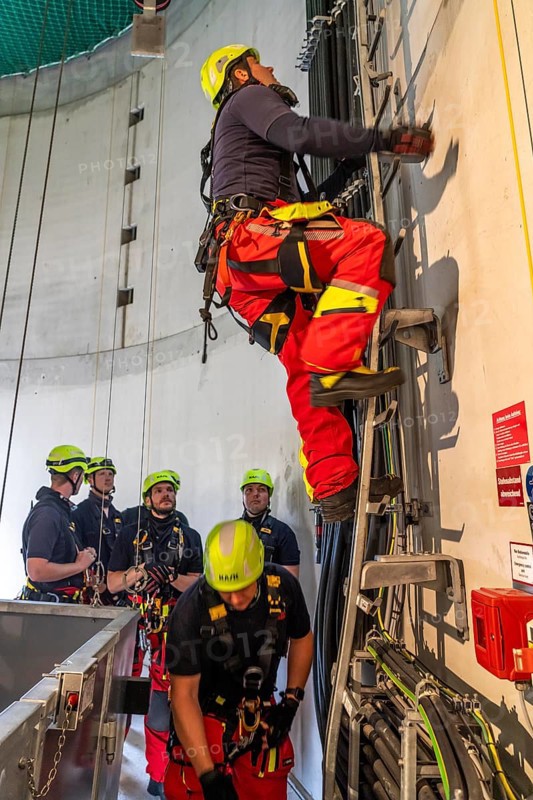 Height rescuers from the Oberhausen professional fire brigade practise abseiling from a wind turbine from a height of 150 metres, ascent into the turbine, to the nacelle, Issum, North Rhine-Westphalia, Germany, Europe