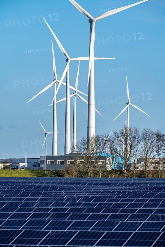 Vopak Solarpark Eemshaven, 19 hectares of solar modules with a capacity of 25 megawatts, around the Vopak tank terminal in the industrial harbour of Eemshaven, wind farm, Groningen, Netherlands