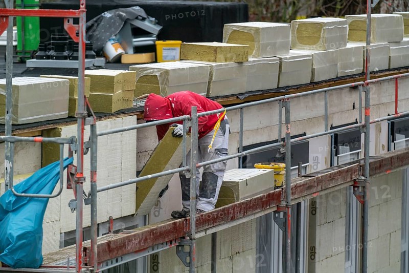Building site, thermal insulation, external insulation, facade insulation, is attached to the facade of a new building, glued, Duisburg, North Rhine-Westphalia, Germany, Europe