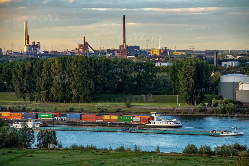 View over the Rhine landscape near Duisburg, to the north, Thyssenkrupp Steel, Bruckhausen steelworks, Schwelgern coking plant, cargo ships on the Rhine, North Rhine-Westphalia, Germany, Europe
