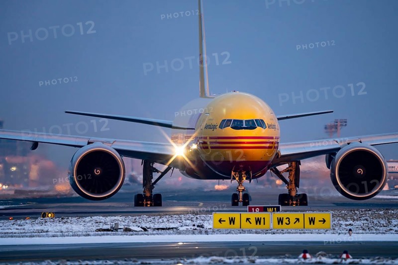 DHL, AeroLogic, Boeing 777F, on the taxiway to Runway West, Frankfurt FRA Airport, Fraport, in winter, Hesse, Germany, Europe