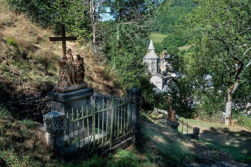 Orcival in Auvergne Volcanoes Regional Natural Park, Statues of Christ's Way of the Cross. Puy de Dome. Auvergne-Rhone-Alpes. France