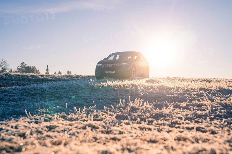 An SUV in a frosty landscape at sunrise, car sharing, electric car, Volkswagen ID 5, Gechingen, Hecken und Gäu region, Black Forest, Germany, Europe