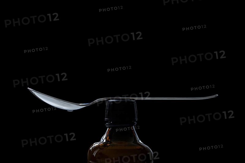 A spoon lying on a bottle in Berlin, 09/08/2024