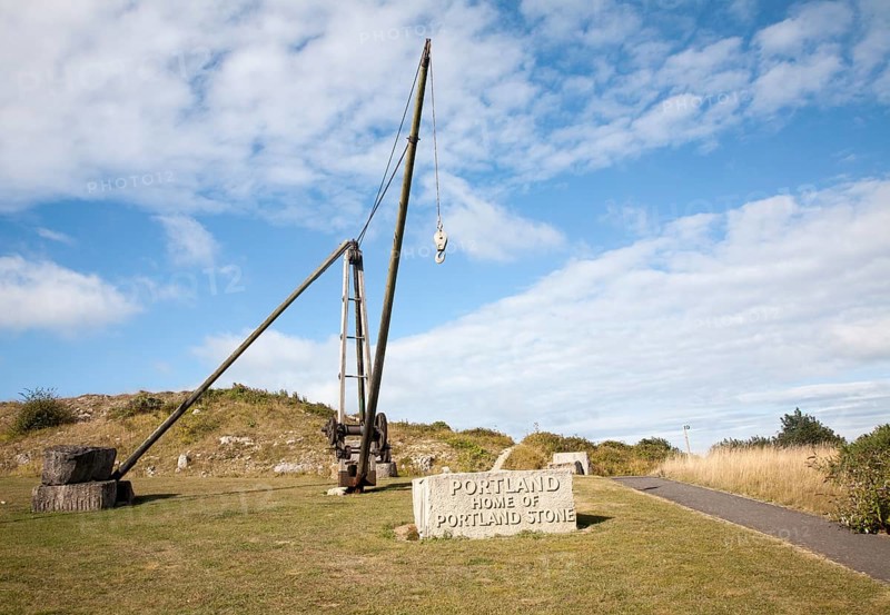 Antique crane forming monument to the quarrying heritage as the 'Home of Portland Stone, Isle of Portland, Dorset, England, UK