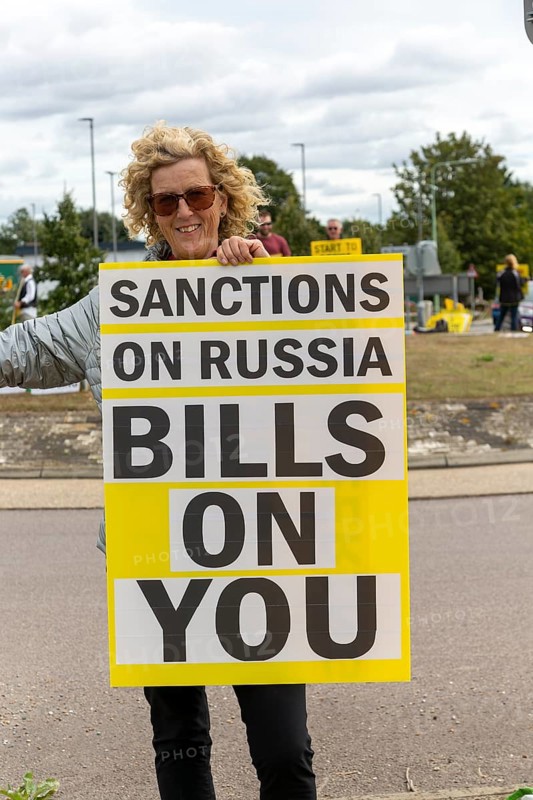 Protest at busy roundabaout, Martlesham, Suffolk, England, UK, opposition to sanctions on Russia