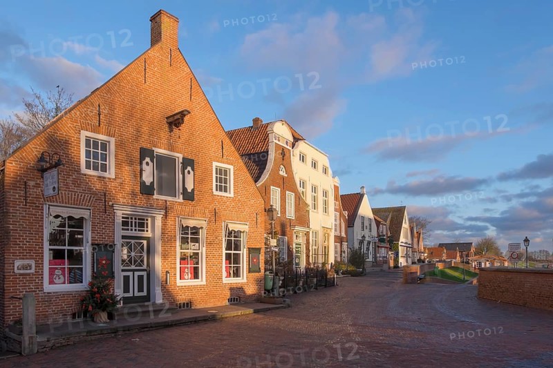 Historic brick houses at the harbour, Greetsiel, Krummhörn, East Frisia, Lower Saxony, Germany, Europe