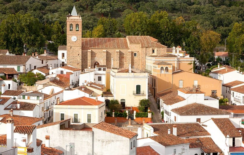 Church and houses in village of Almonaster La Real, Sierra de Aracena, Huelva province, Spain, Europe