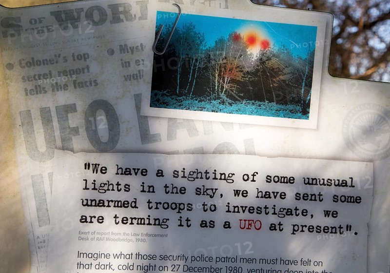 Newspaper headline reports on notice sign at Rendlesham UFO trail, Rendlesham forest, Suffolk, England, UK