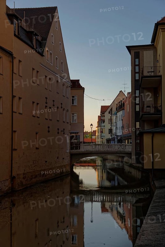 Last rays of sunshine over the river Vils surrounded by houses, Amberg, Upper Palatinate, Bavaria, Germany, Europe