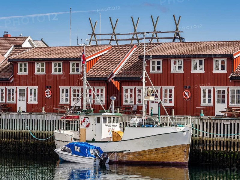Typical red wooden houses at the harbor, Svolvær, Lofoten, Norway, Europe