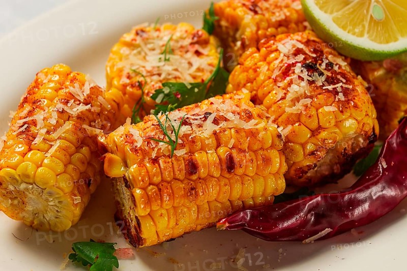 Grilled corn with spices, top view, no people, homemade