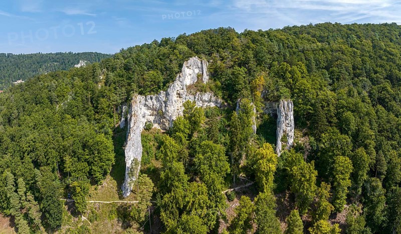 UNESCO World Heritage Caves and Ice Age Art of the Swabian Alb. Ice Age cave Geißenklösterle in the Achtal valley, site of important archaeological excavations from the Aurignacian period, drone photo. Blaubeuren, Baden-Württemberg, Germany, Europe