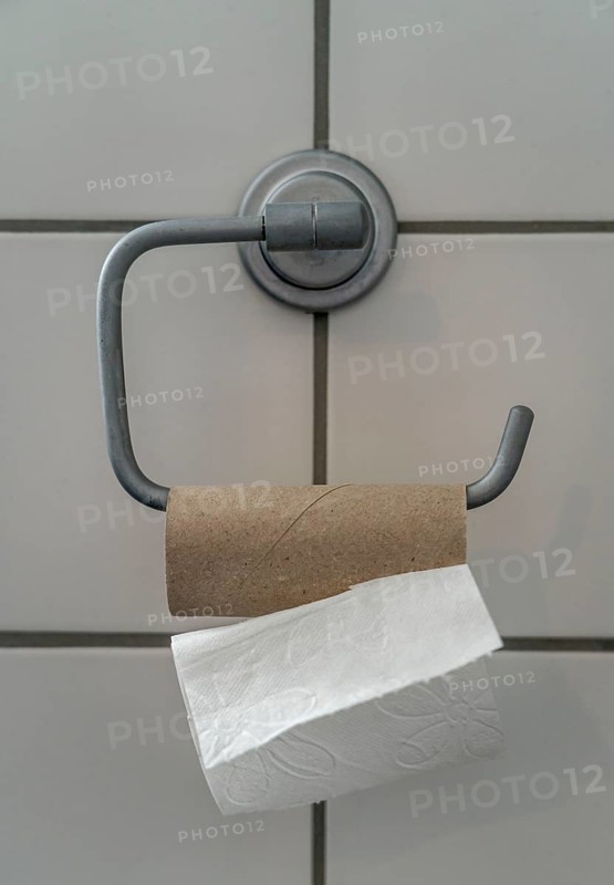 Last sheet of toilet paper on a toilet roll