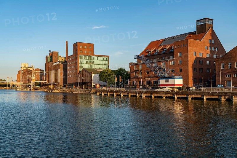 The inner harbour, in Duisburg, Küppersmühle building, and Werhahn-Mühle, granary with Explorado Children's Museum, Faktorei 21 building, right, North Rhine-Westphalia, Germany, Europe