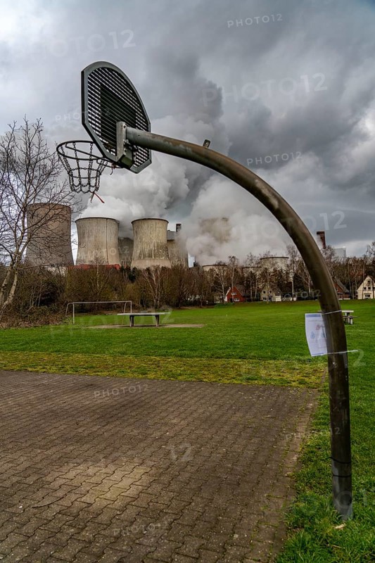 Lignite-fired power station, RWE Power AG Niederaußem power station, Auenheim district, directly at the power station, sports ground, belongs to Bergheim, North Rhine-Westphalia, Germany, Europe