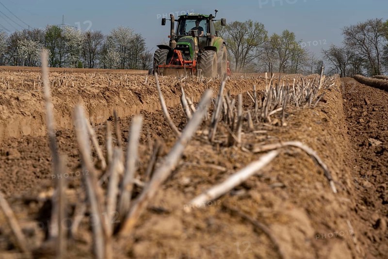 A farmer builds asparagus ridges on a field with the help of an asparagus tiller, in which the asparagus then grows, Dormagen, North Rhine-Westphalia, Germany, Europe