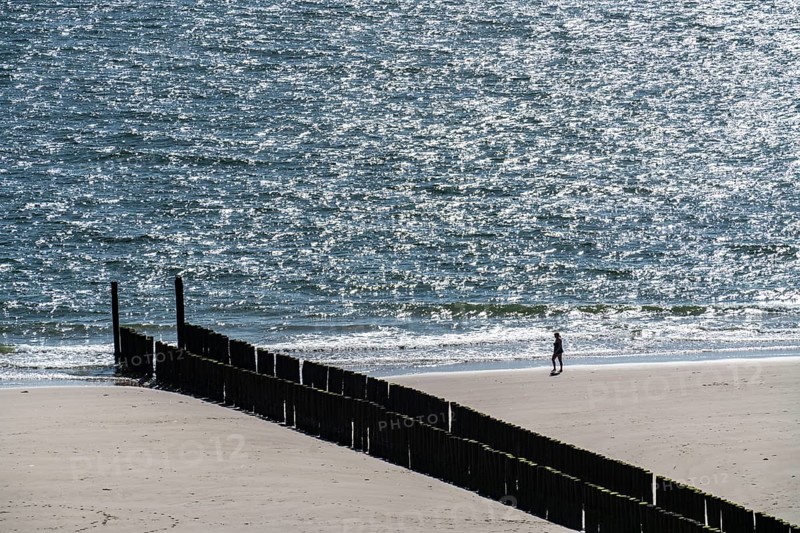 Strollers on the beach near Zoutelande, breakwater, province of Zeeland, Walcheren peninsula, Netherlands