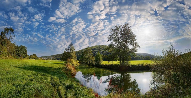 Panoramic landscape at the river Vils with wide meadow, trees and bright sky, Emhof, Kallmünz, Upper Palatinate, Bavaria, Germany, Europe