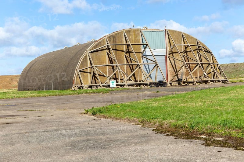 Aircraft hangar for jet fighter military planes, former USAF base, Bentwaters Park, Suffolk, England, UK