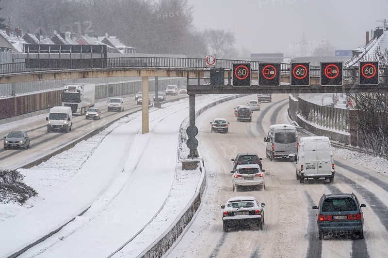 A40 motorway, onset of winter, lots of fresh snow and daytime temperatures below minus 5 degrees, uncleared road, little traffic, poor road conditions, Essen, North Rhine-Westphalia, Germany, Europe
