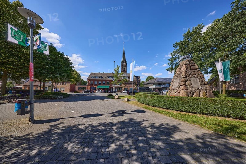 Church of St. Pancratius, war memorial and Weseler Strasse in the Buldern district, Dülmen, Münsterland, Coesfeld district, North Rhine-Westphalia, Germany, Europe