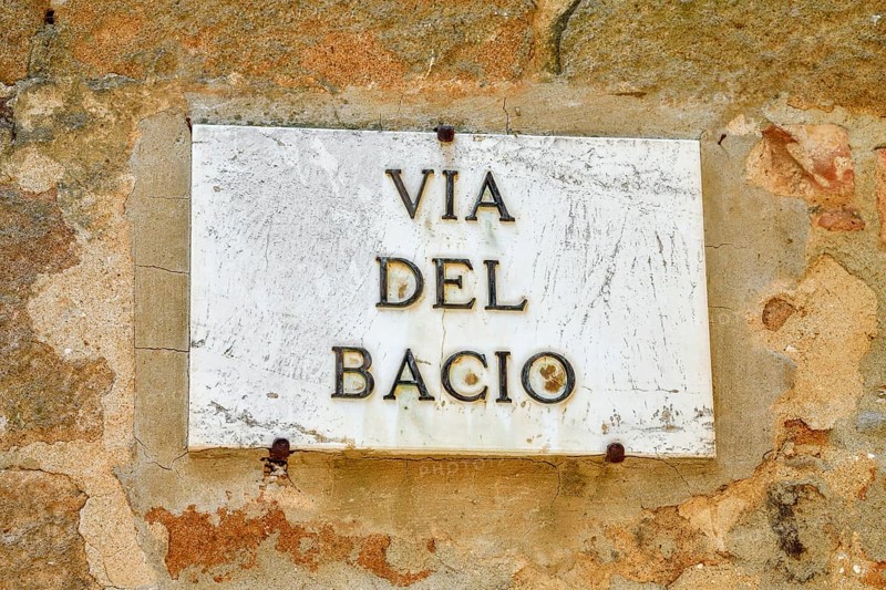 Street sign Via del Bacio, Road of the Kiss, Pienza, Val d'Orcia, Orcia Valley, Tuscany, Italy, Europe