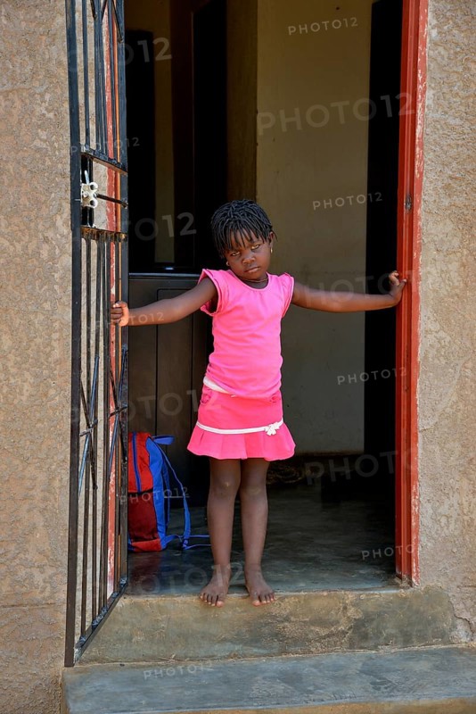 Himba girl in a house in the Himba district of Otuzemba, Otuzemba, Opuwo, Kaokoland, Kunene, Namibia, Africa