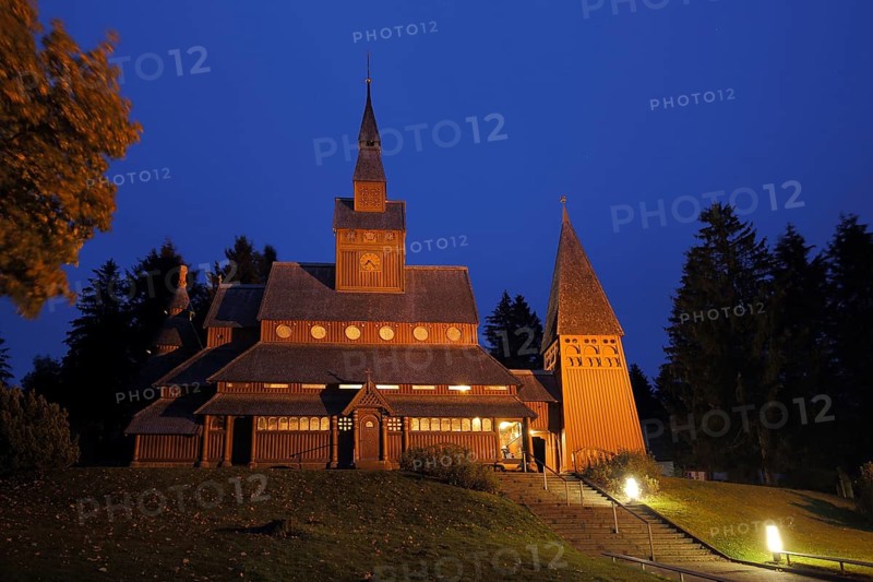 Night shot of the Gustav-Adolf-Stabkirche, twilight, blue hour, wooden church, lighting, Hahnenklee, Harz, Lower Saxony, Germany, Europe