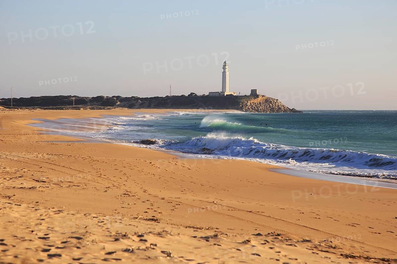 Sandy beach and lighthouse at Cabo de Trafalgar, Cadiz Province, Spain, Europe
