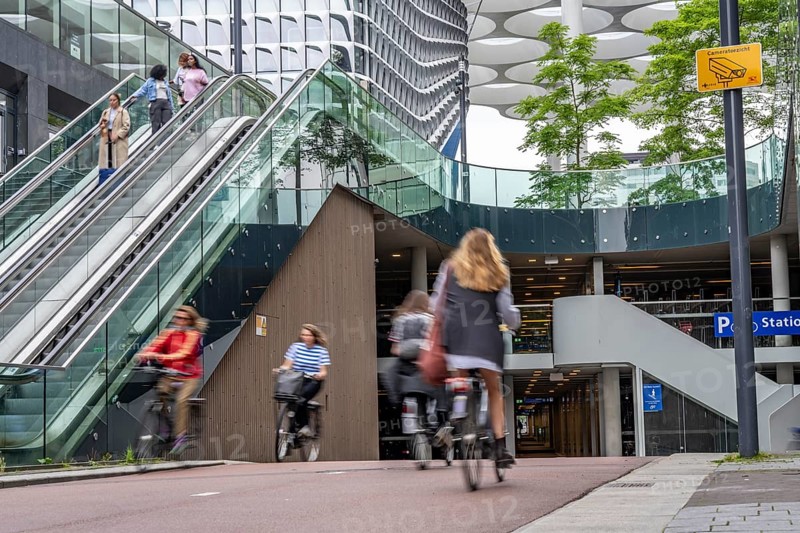 Entrance and exit of the bicycle car park at Utrecht Centraal station, Stationsplein, over 13, 000 parking spaces, considered the largest bicycle car park in the world, over 3 underground floors, Utrecht, Netherlands