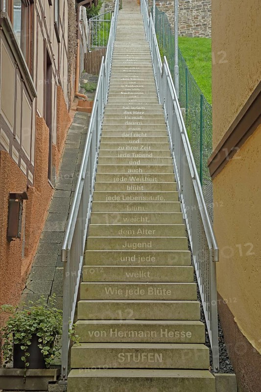 Staircase with poem Steps by Hermann Hesse, staircase with inscription, 'As every blossom withers and every youth gives way to age, every stage of life blossoms, every wisdom also blossoms and every virtue in its time and must not last forever...', text, words, literature, poetry, staircase, Biedenkopf, Hesse, Germany, Europe