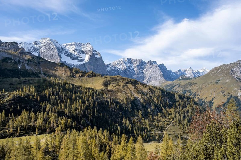 Mountain panorama with steep rocky peaks, yellow-coloured larches in autumn, view of Laliderspitze, Dreizinkenspitze and Spritzkarspitze peaks, hike to the summit of Hahnkampl, Engtal, Karwendel, Tyrol, Austria, Europe