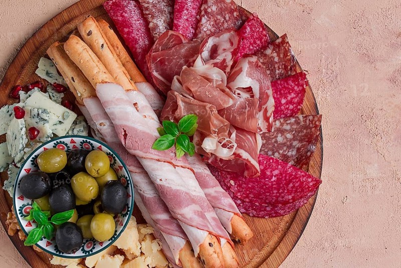 Appetizer, assortment, set, sausage, and cheese, on a wooden board, top view, no people
