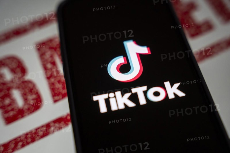 In this photo illustration, logo of Tiktok is displayed on mobile phone screen next to ban sign, in Guwahati, India 25 April 2024. US President Joe Biden signs law to ban Chinese-owned TikTok unless sold to US company
