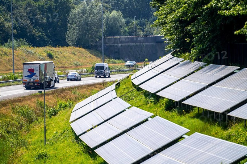 A58 motorway, photovoltaic systems were installed on the slopes to the side of the carriageway, use of the areas along the roads as a solar park, near Etten-Leur, Noord-Brabant, Netherlands