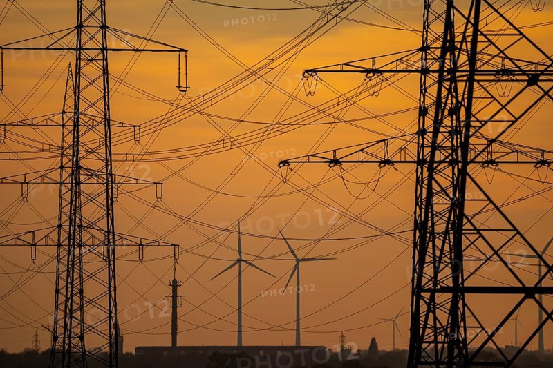 Extra-high-voltage lines, 380 KV, power line, wind turbine, the electricity comes from the Rhenish lignite mining area, at the Neurath power station, near Grevenbroich, Germany, Europe